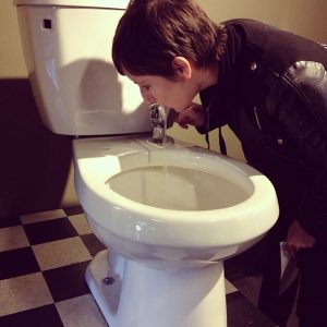 Drinking_out_of_a_toilet_fountain_at_the_Exploratorium