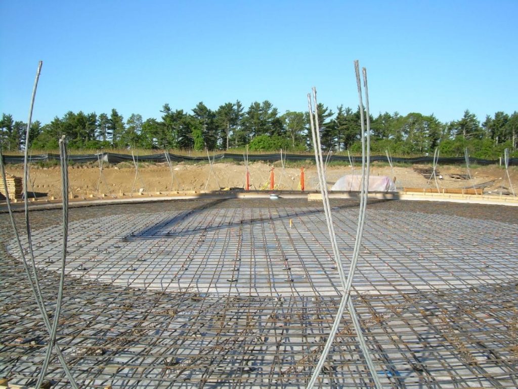 Tank floor/footing reinforcing steel and seismic cables prior to concrete pour