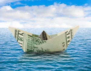 Business concepts - ship from dollar money on water