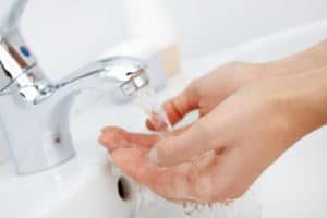 Hands_in_Water_faucet-300x200