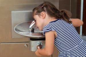 child_drinking_water_fountain