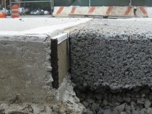 A porous concrete sidewalk filters rain back into the ground instead of the sewer system. Photo courtesy of NYC Environmental Protection.