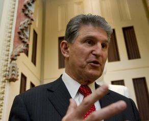 UNITED STATES - Jan 14: Sen. Joe Manchin, D-WVA., talks with reporters on the way to the Senate policy luncheons in the U.S. Capitol on January 14, 2014. (Photo By Douglas Graham/CQ Roll Call)